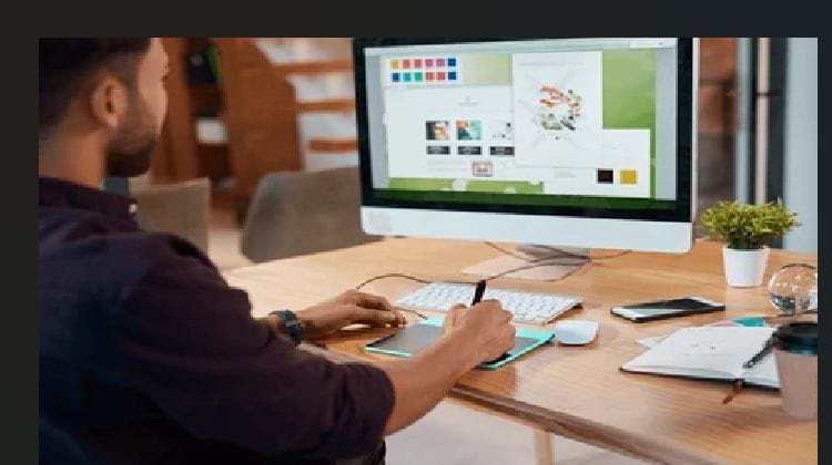 Website designer in Benin City working on a business website.